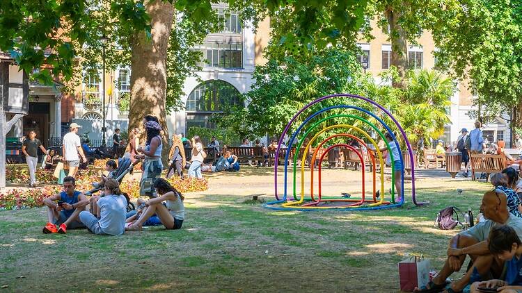Londoners in a grassy square in a heatwave Londoners in a grassy square in a heatwave