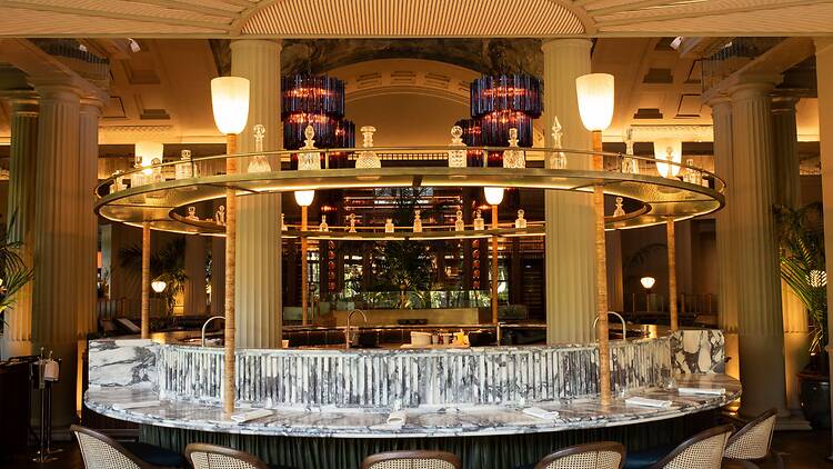 The beautiful ocean-inspired bar acts an ashore to the room. 
