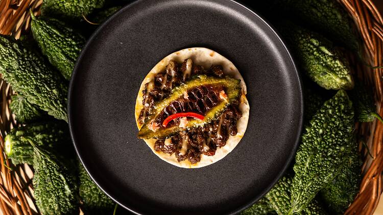 The meat karela and baked naan at Indian Accent Mumbai