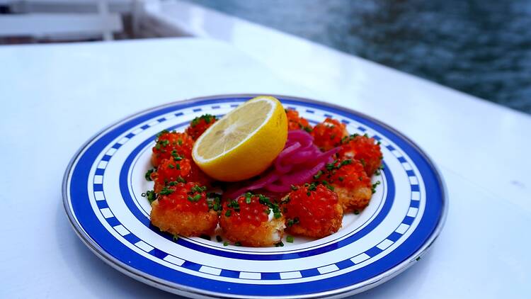 A plate of tater tots with roe