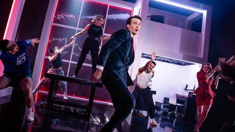 American Psycho – The Musical People on stage dancing during a play.