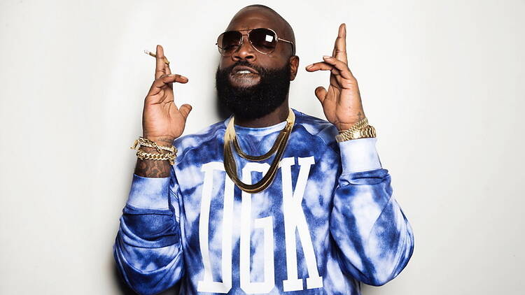 A close-up of a person wearing sunglasses posing in front of a white studio backdrop A close-up of a person wearing sunglasses posing in front of a white studio backdrop