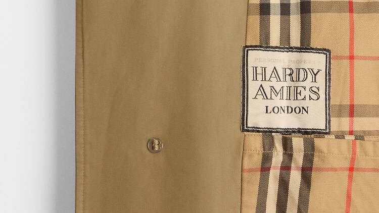 Detail of the personalised label in British fashion designer Hardy Amies’s Burberry car coat_ 1979