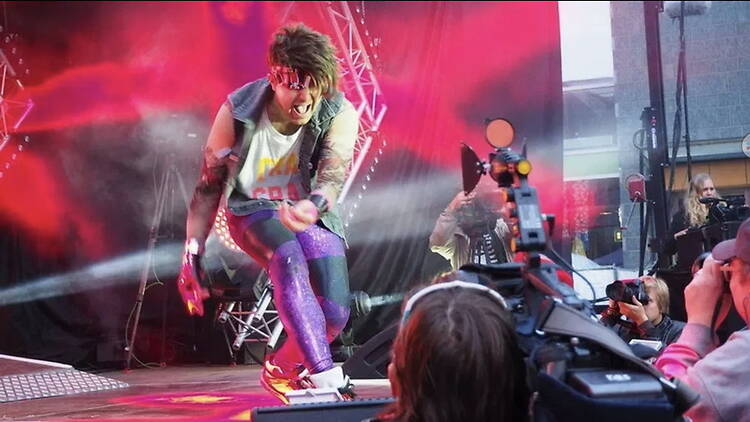 A close-up of a musician performing on stage at a live music event.