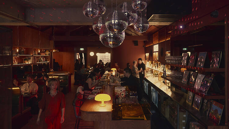 Disuko Disco balls hanging over the bar at Disuko.