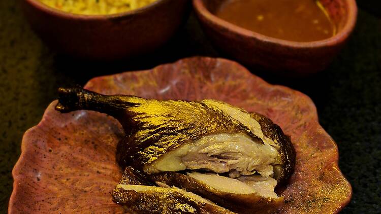 The duck leg with chilli garlic fried rice and gochujang sauce at Yyaki