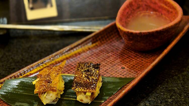 Duck skin nigiri with fresh wasabi and hoisin at Yyaki