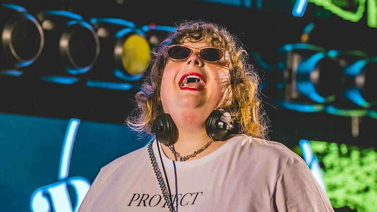 A close-up of a person wearing headphones on a stage A close-up of a person wearing headphones on a stage