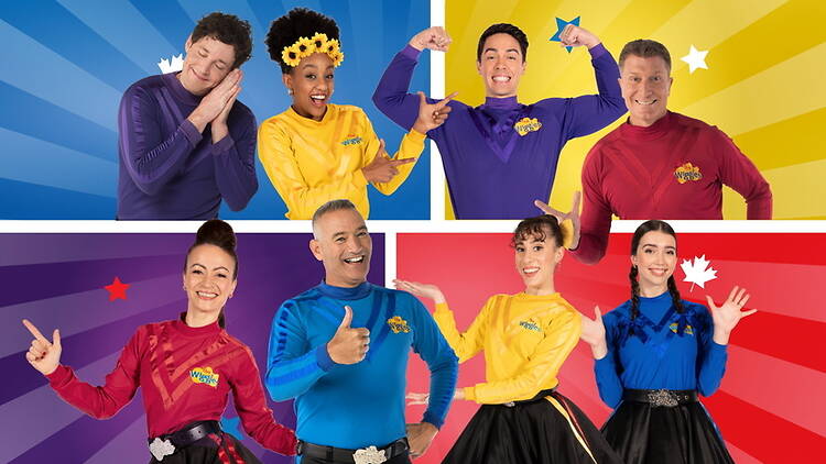 A group of people posing together against colorful backgrounds A group of people posing together against colorful backgrounds