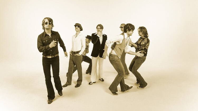 A group of people interacting in a studio A group of people interacting in a studio