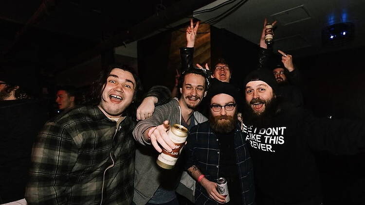 A group of attendees partying at an indoor event.