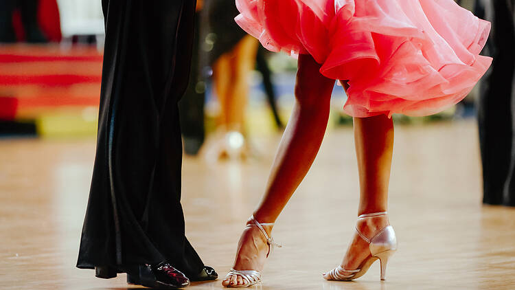 Couple at dance competition couple feet of dancers, woman and man latino dancing