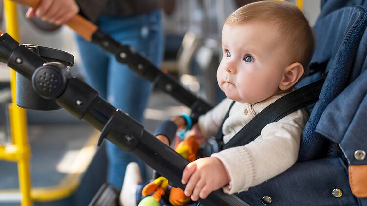 Baby in a stroller on the bus, Baby in a stroller on the bus,