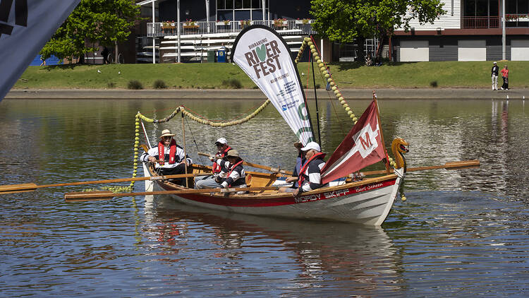 Birrarung Riverfest People on a boat on a river.