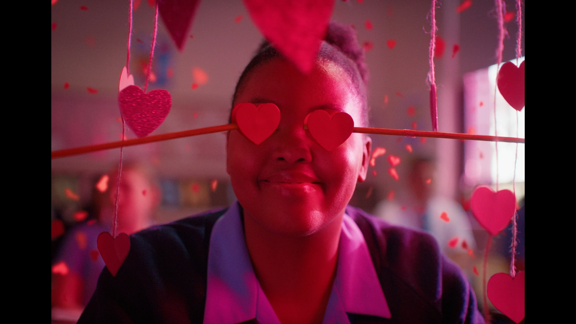 Luthando, played by Esihle Ndleleni, wears heart-shaped glasses in a scene from Black Burns Fast.