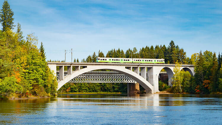 A VR train crossing a bridge in Finland, Kouvola, Koria A VR train crossing a bridge in Finland, Kouvola, Koria
