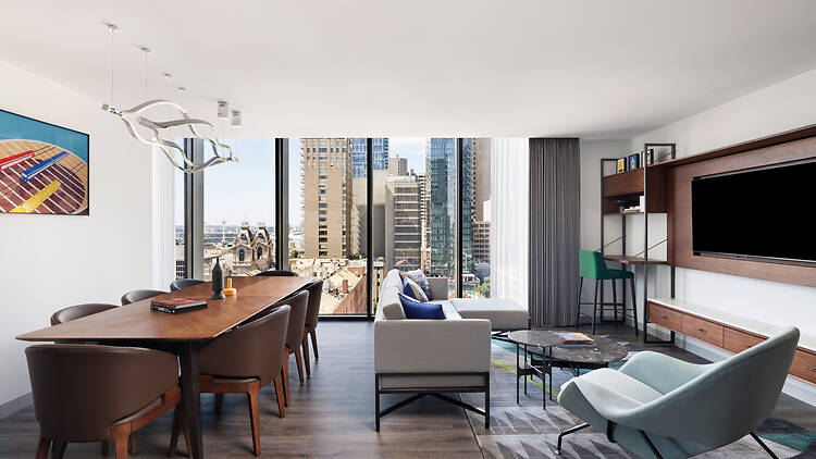 The dining and living room in Le Méridien Melbourne's Palace Suite.