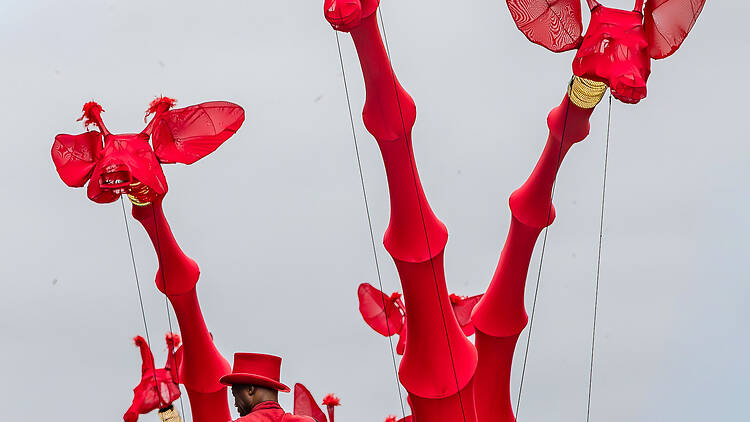 The evening’s main event: giant giraffes take over the city centre