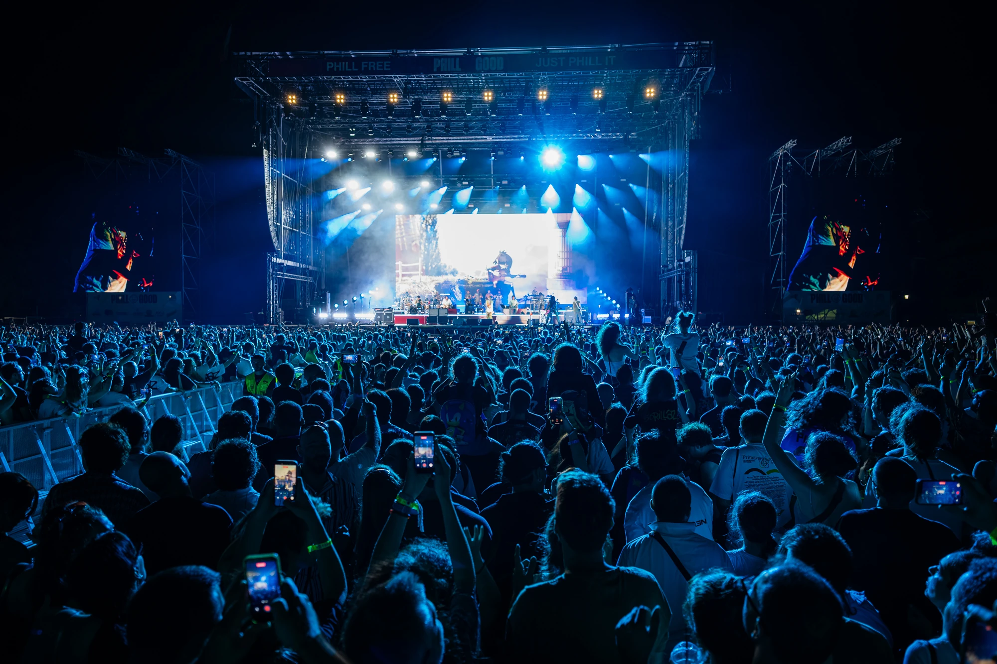 Gorillaz performing at Phillgood Festival, to a large crowd at the front of the frame
