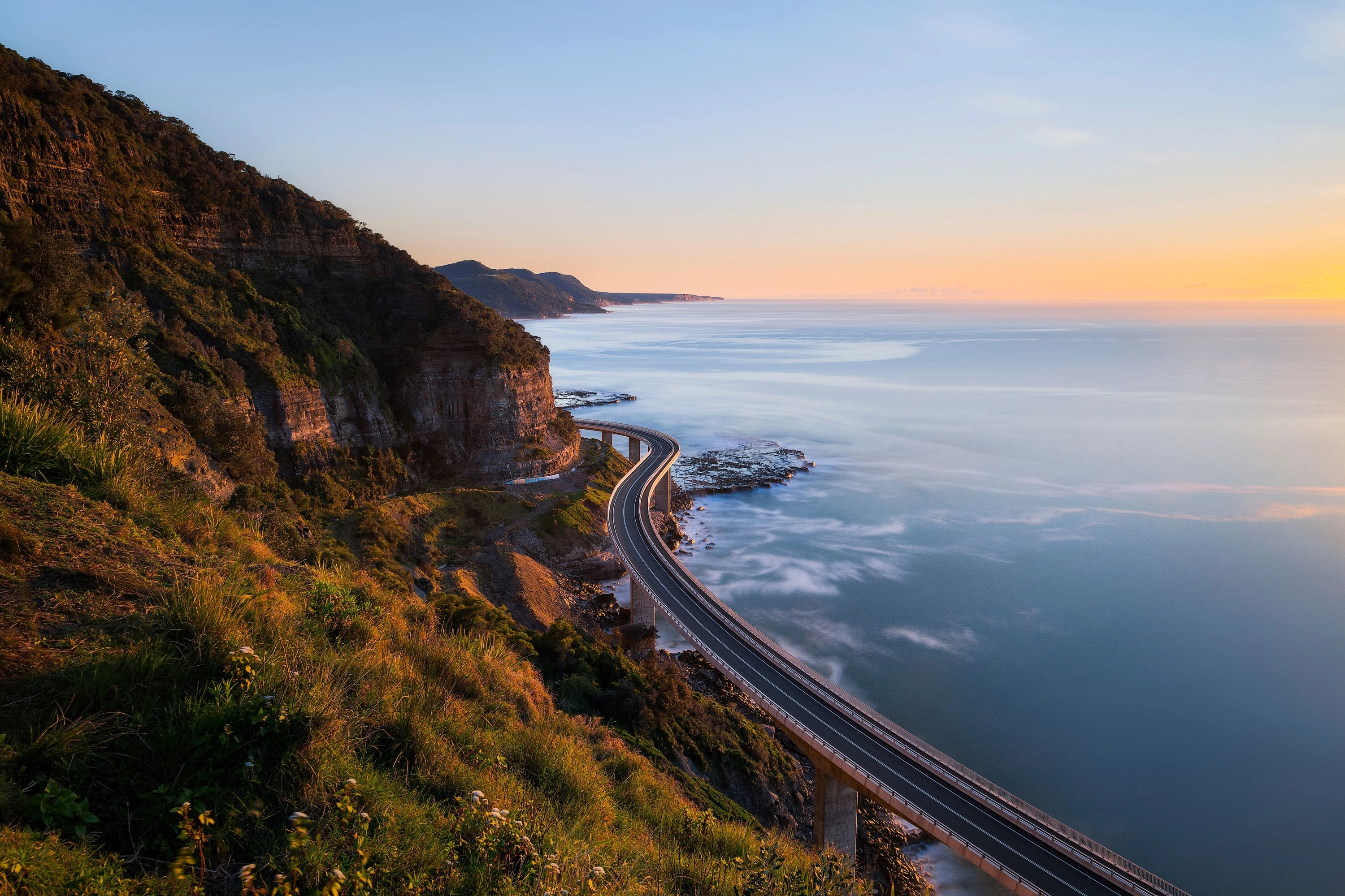 Sun rising over the Sea Cliff Bridge, Clifton.