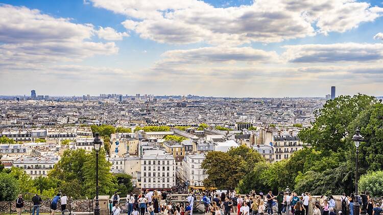 Crowds of tourists at the bottom the stairs of the Sacré Coeur in Paris Crowds of tourists at the bottom the stairs of the Sacré Coeur in Paris