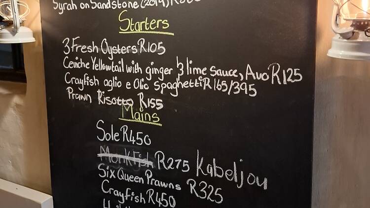 The real magic is on the chalkboard at Fisherman's Cottage in Hermanus