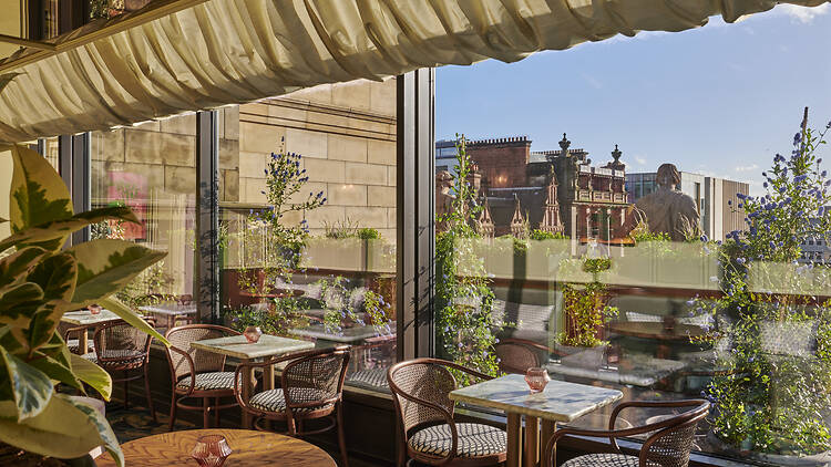 Rooftop bar Lamplighters from the inside, with views out across the city