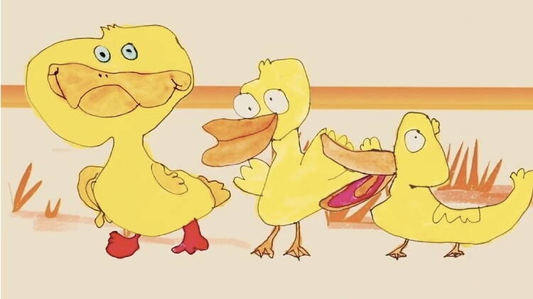 A wide shot of three cartoon yellow ducks walking outdoors. A wide shot of three cartoon yellow ducks walking outdoors.
