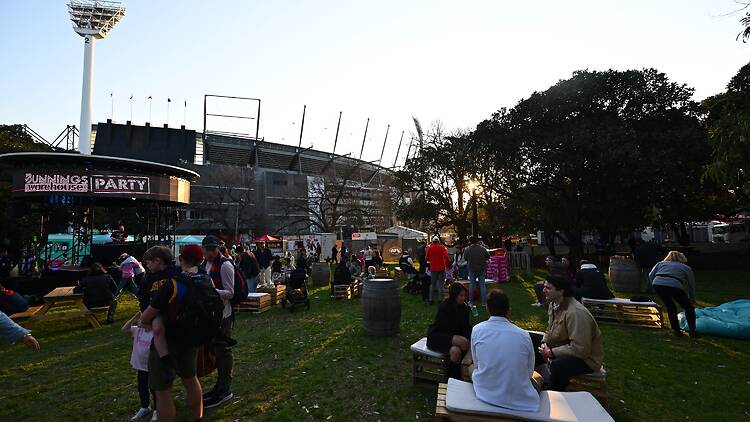 Crowds gathered at park outside stadium to celebrate the AFL Grand Final Parade & Footy Fest.