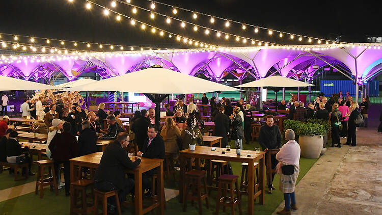 Sydney Spiegeltent Festival Garden Attendees gather in Sydney Spiegeltent's festival garden for opening night of Sydney Fringe Festival