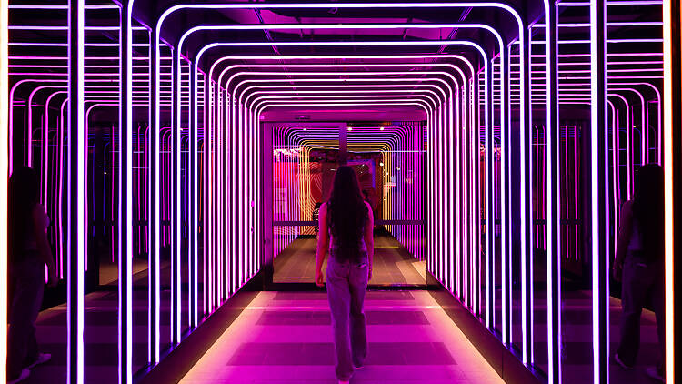 Melrose Central Light Tunnel A woman walks through Melrose Central's light tunnel