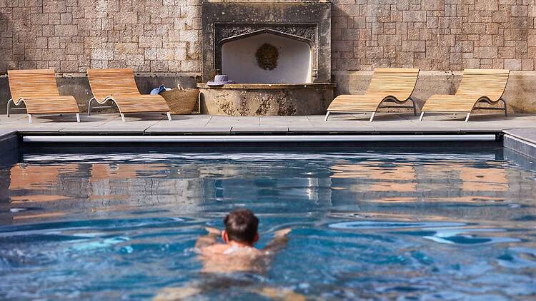 The Tawny’s outdoor heated swimming pool is Set within the historic walled garden area of the estate, it features poolside loungers and an original stone fountain inset into the historic brick wall