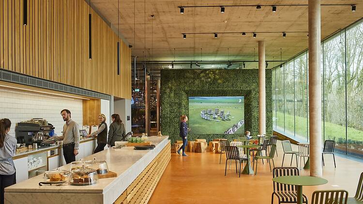 A modern cafe interior with wooden slatted wall 