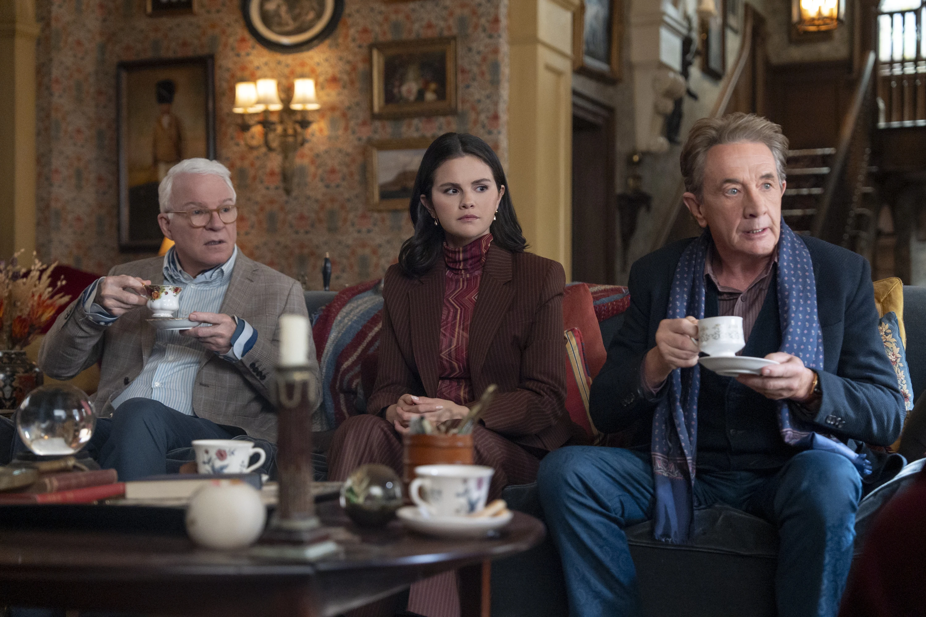 Charles (Martin), Mabel (Gomez), and Oliver (Short) with their afternoon tea in season 6 of Only Murders in the Building