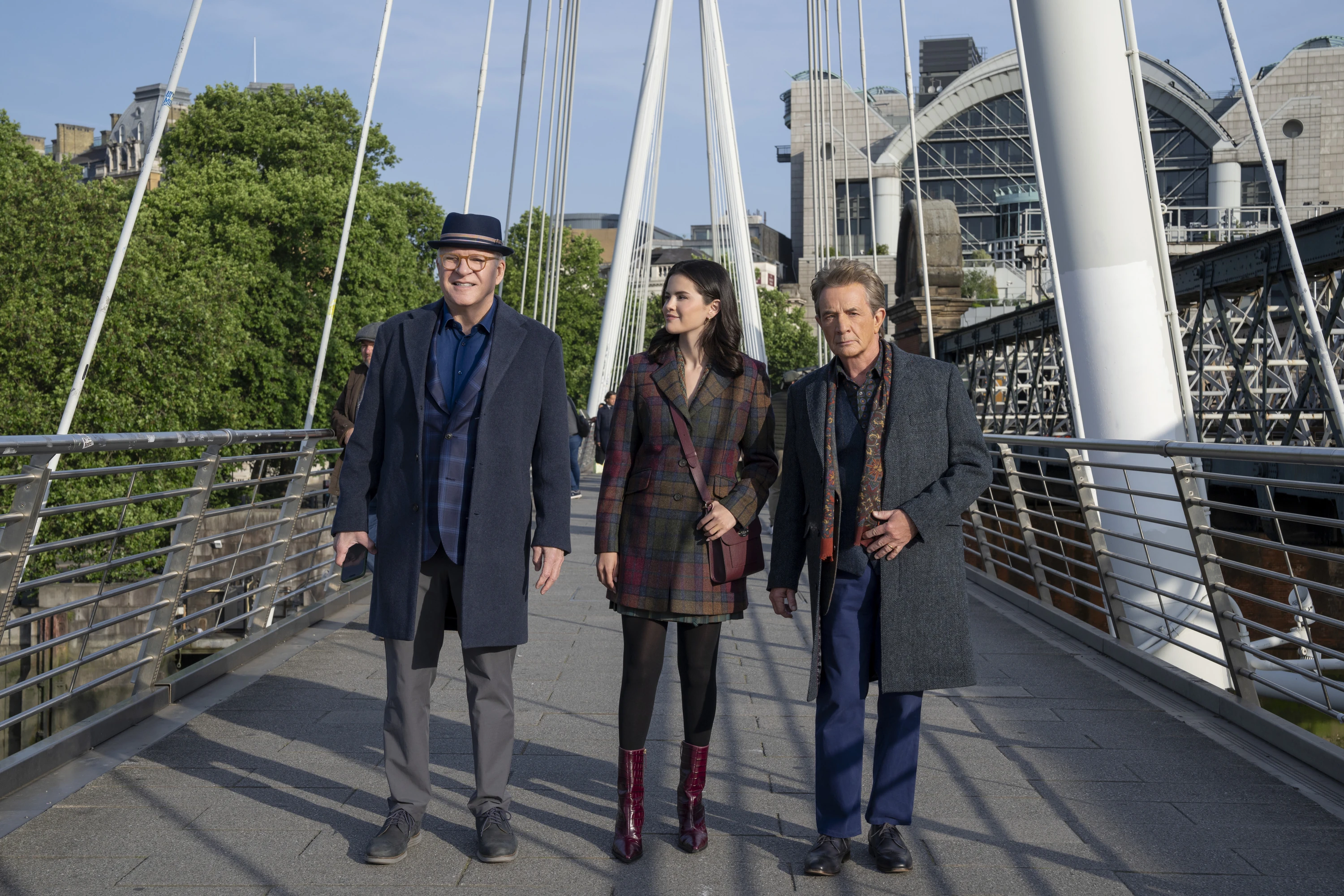 Charles (Martin), Mabel (Gomez), and Oliver (Short) walking in London in season 6 of Only Murders in the Building