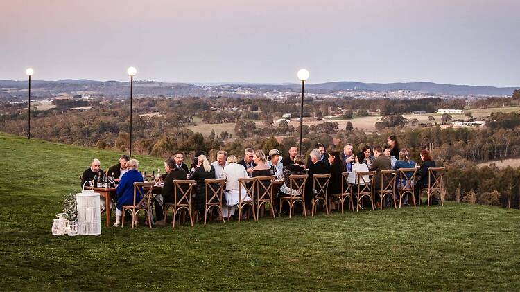 Orange Wine Festival people sitting at a long table outdoors