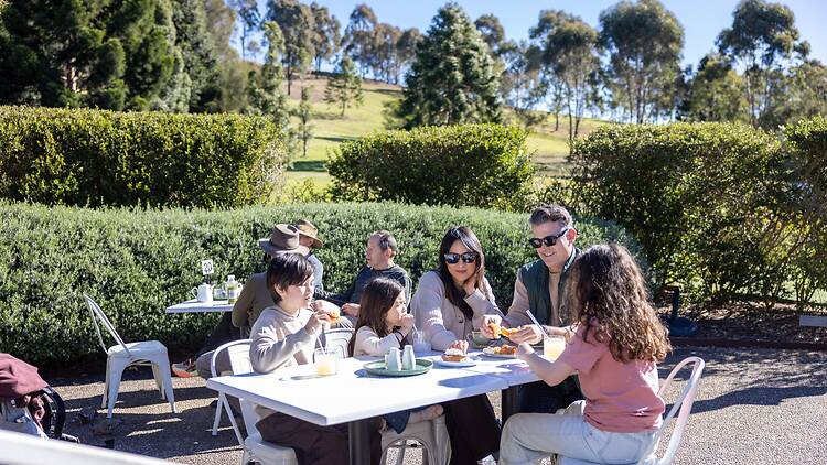 A family picnics at Australian Botanic Garden Mount Annan