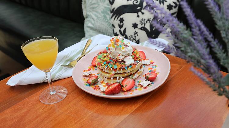 A table with fruity pebble pancakes