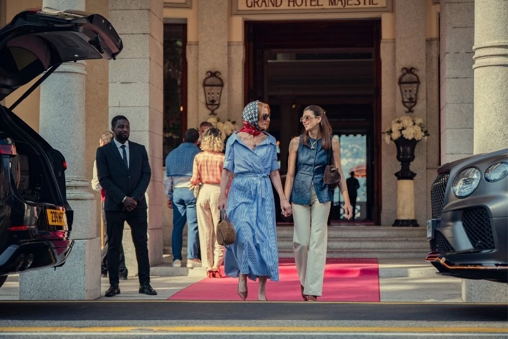Joely Richardson and Jasmine Blackborow outside the Grand Hotel Majestic in a still from The Gentlemen season 2. 