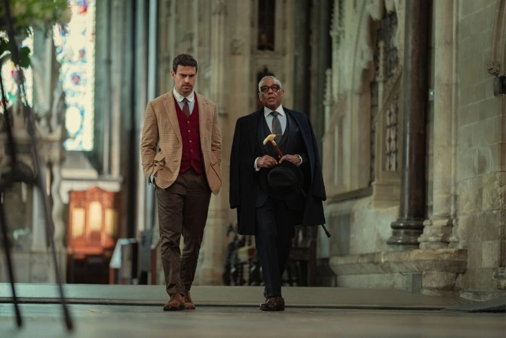 Theo James and Giancarlo Esposito at Salisbury Cathedral in a still from The Gentlemen season 2. 