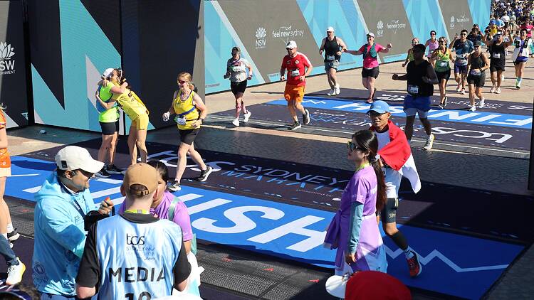 Sydney Marathon Runner crossing finish line