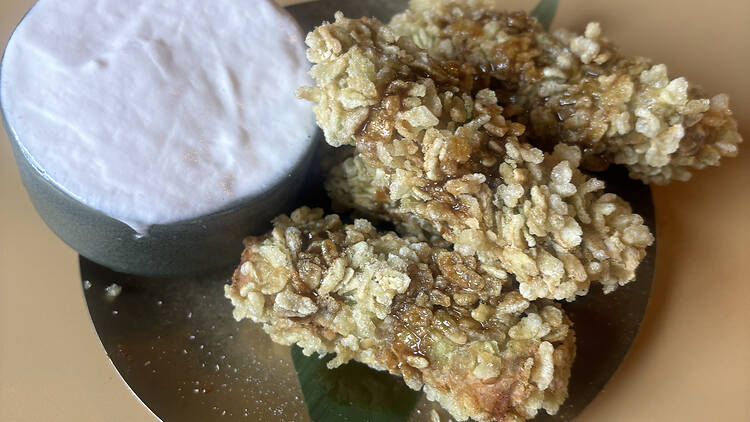 A plate of banana fritters and coconut ice cream.