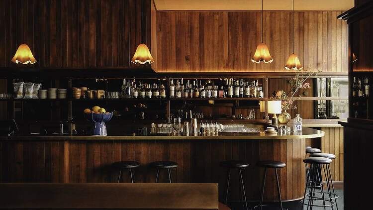 A wooden bar with mood lighting.