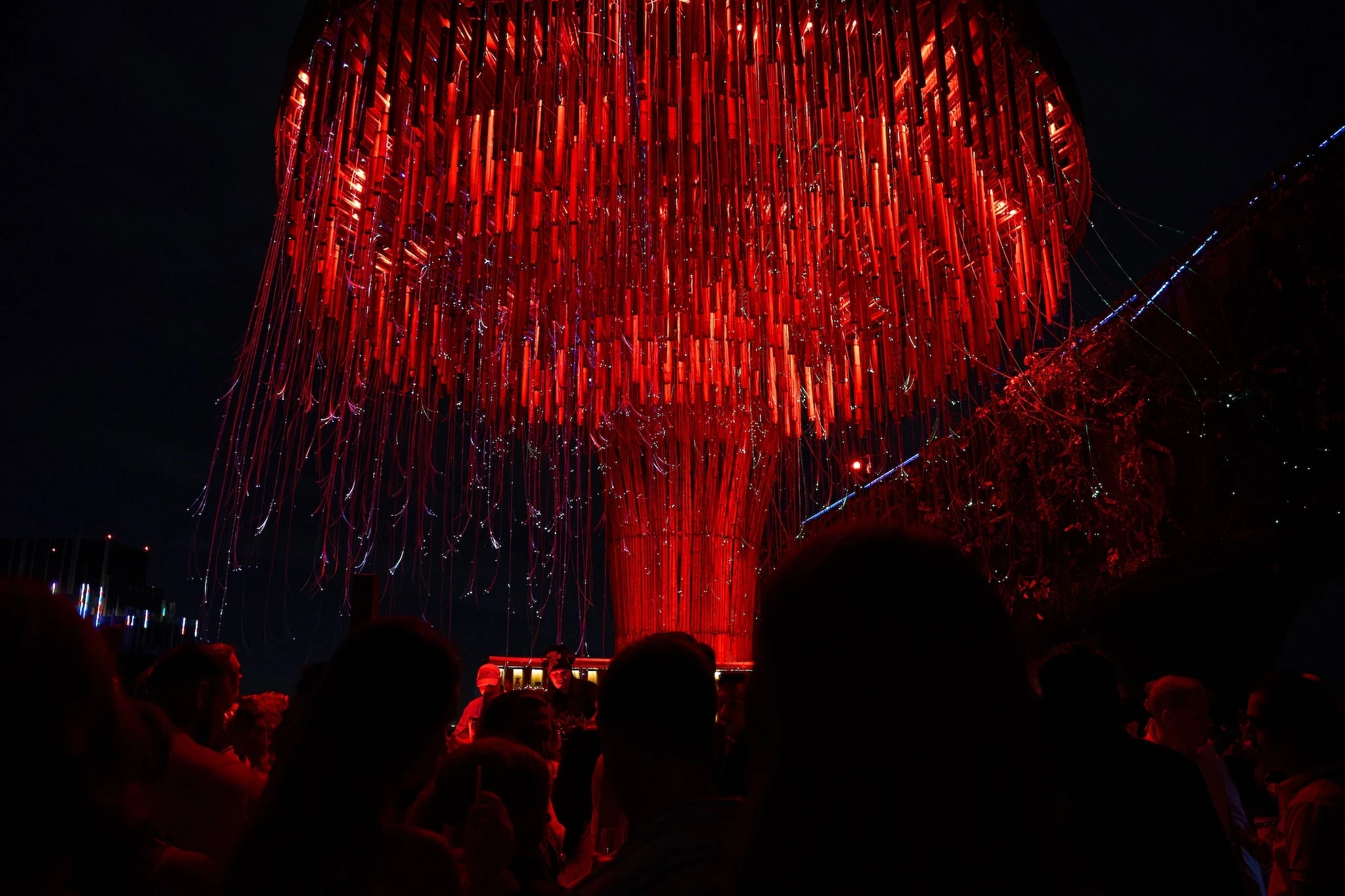 A red chandelier hangs in a bar in Bangkok