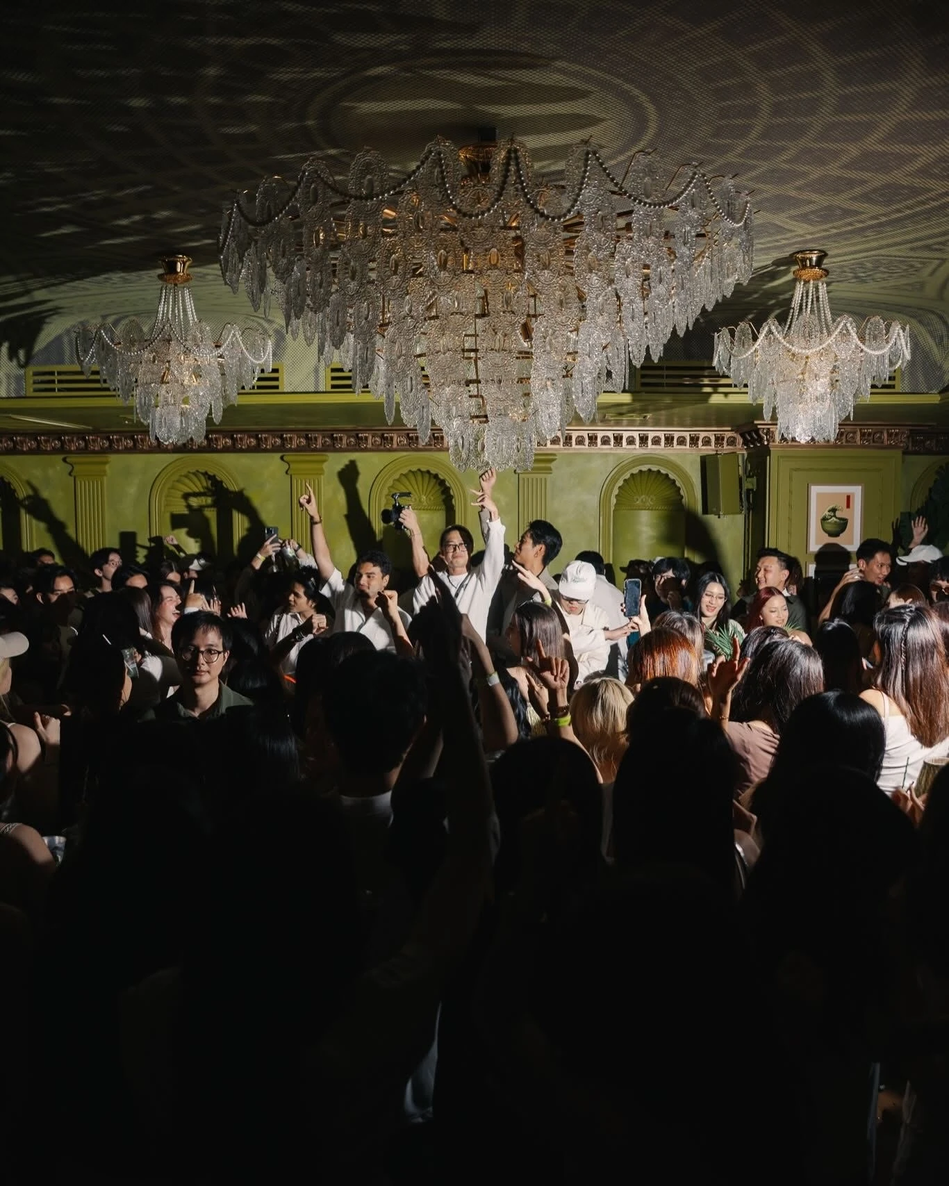People dancing under a chandelier in Bangkok bar What&rsquo;s Happened?