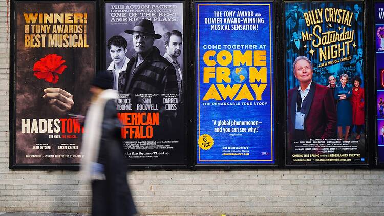 Posters for Broadway musicals on a New York street Posters for Broadway musicals on a New York street