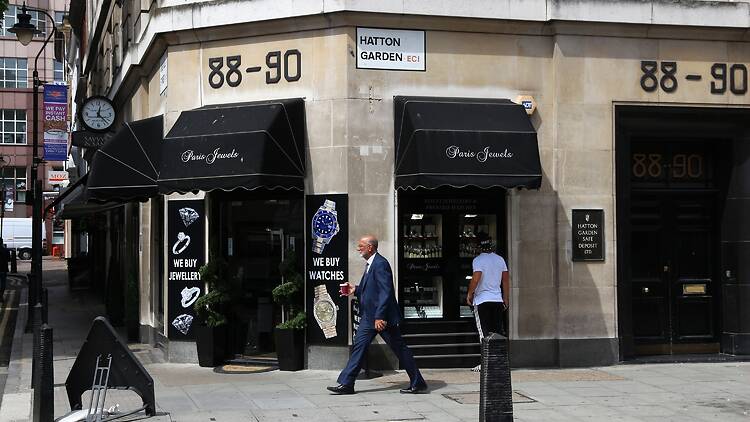 People walking past the Hatton Garden Safe Deposit Company that was involved in the 2015 heist
