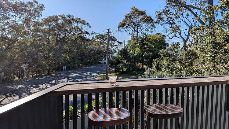 A balcony looking out over bush