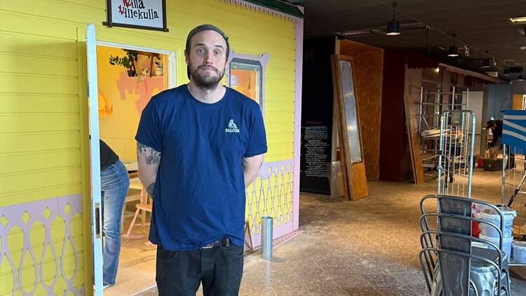 Kollektivet livet owner Carl Adam Kjellström Carl-Adam Kjellström stands inside Bar Kollektivet Livet at Slussen beside a colourful Villa Villekulla-inspired structure under construction.