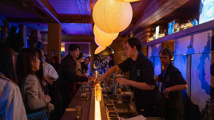 Suntory House bar Bartenders pouring drinks at Suntory House